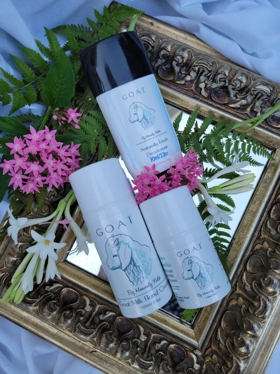 GOAT skincare products with flowers on mirror frame